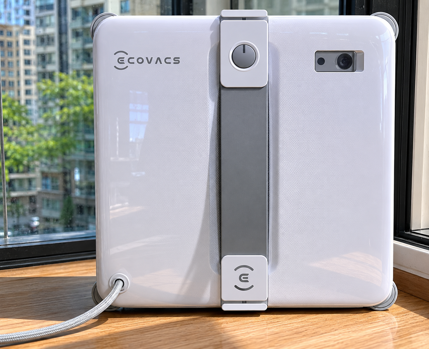ECOVACS WINBOT MINI2 window cleaning robot on a van side window