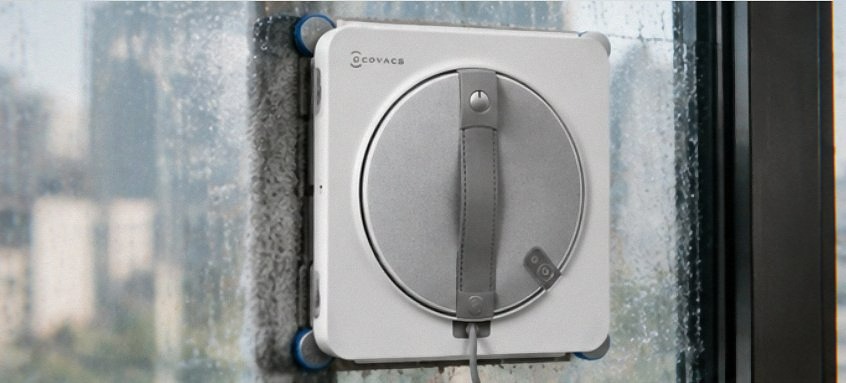 ECOVACS WINBOT W2S Omni window cleaning robot docked in its 6-in-1 multifunction station